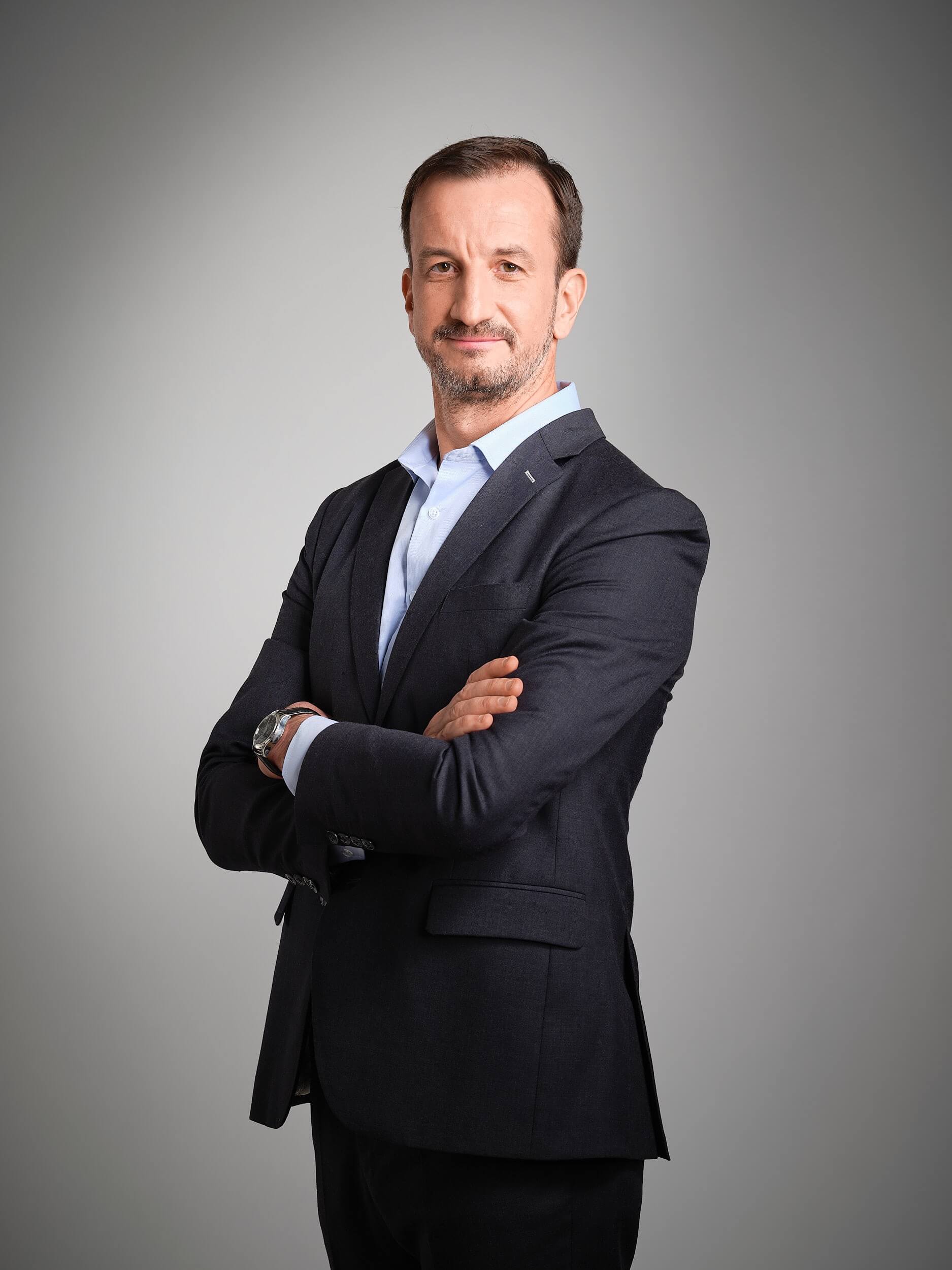 Professional headshot of Oliver Bertram smiling